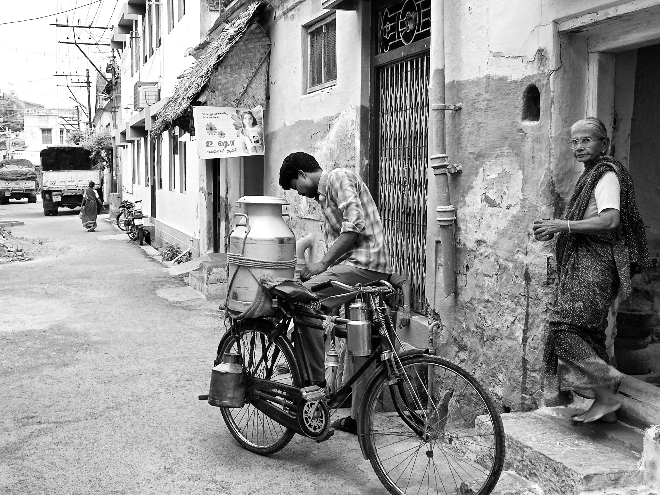 Milkman selling milk to households, Virudhunagar, Tamil Nadu, India