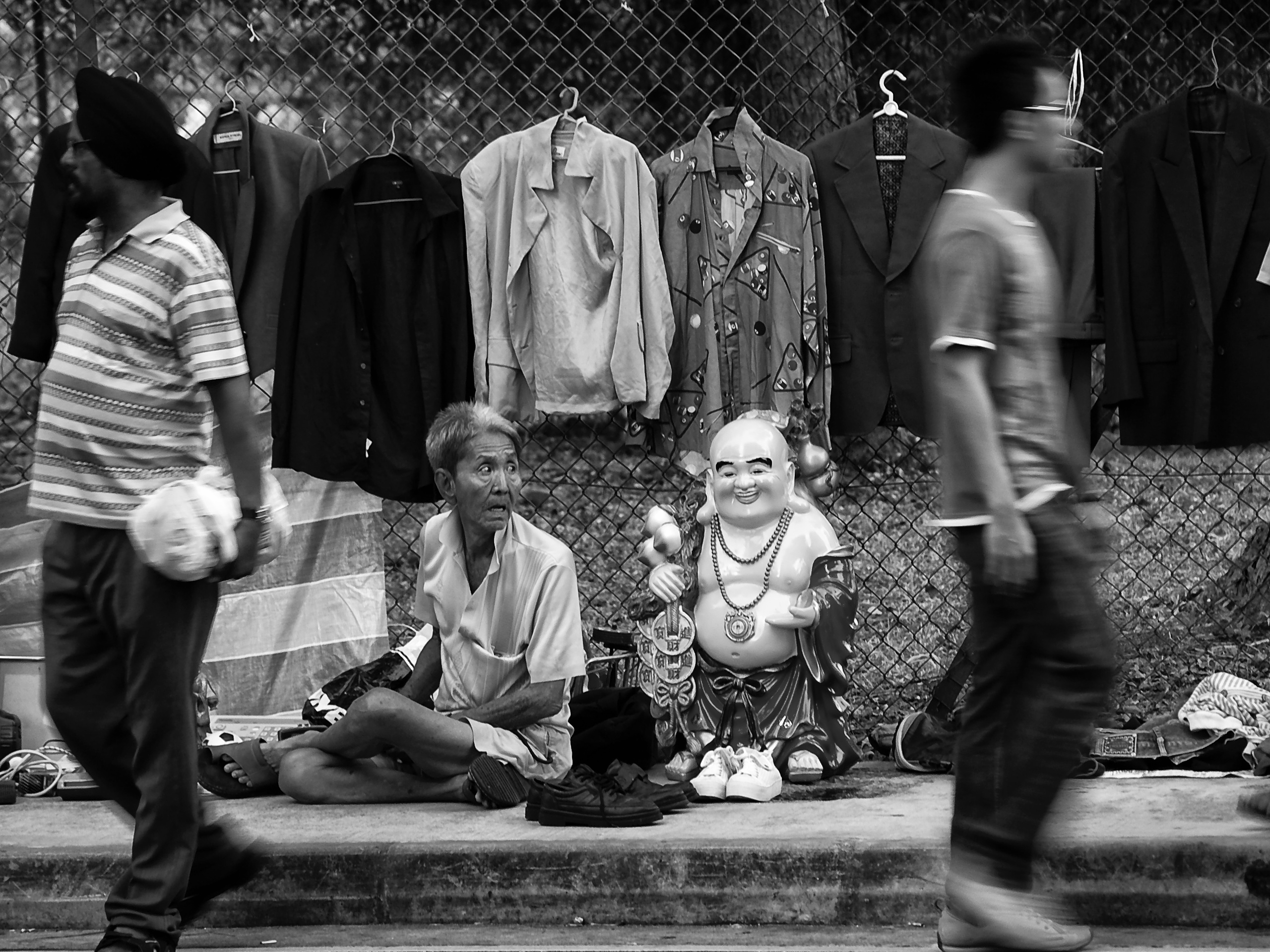 Beside the laughing Buddha, a street scene at Jln Besar market, Singapore