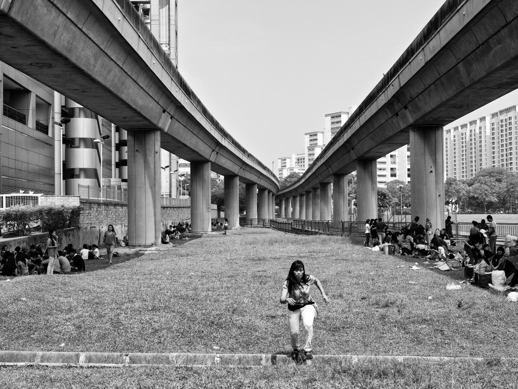 Indonesian migrant workers gathered under the railway bridge for their day-off get-together, PayaLebar, Singapore