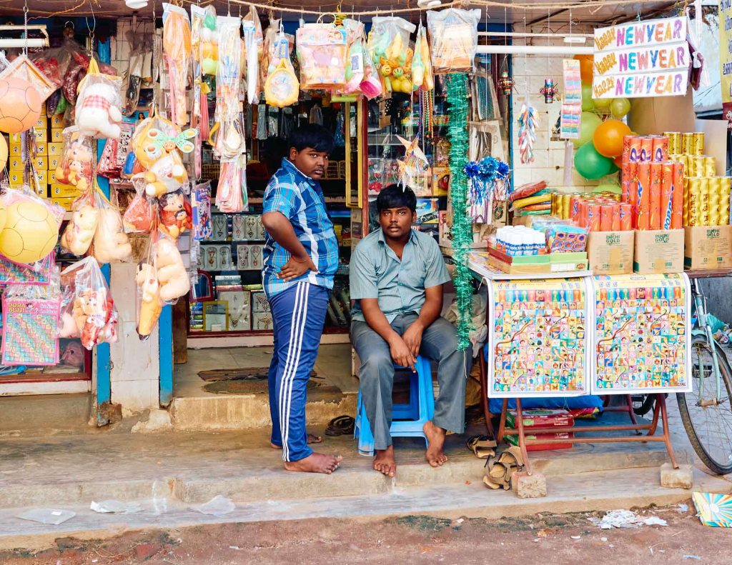 Two young men at a toy shop that sells home decor and toys,Madurai