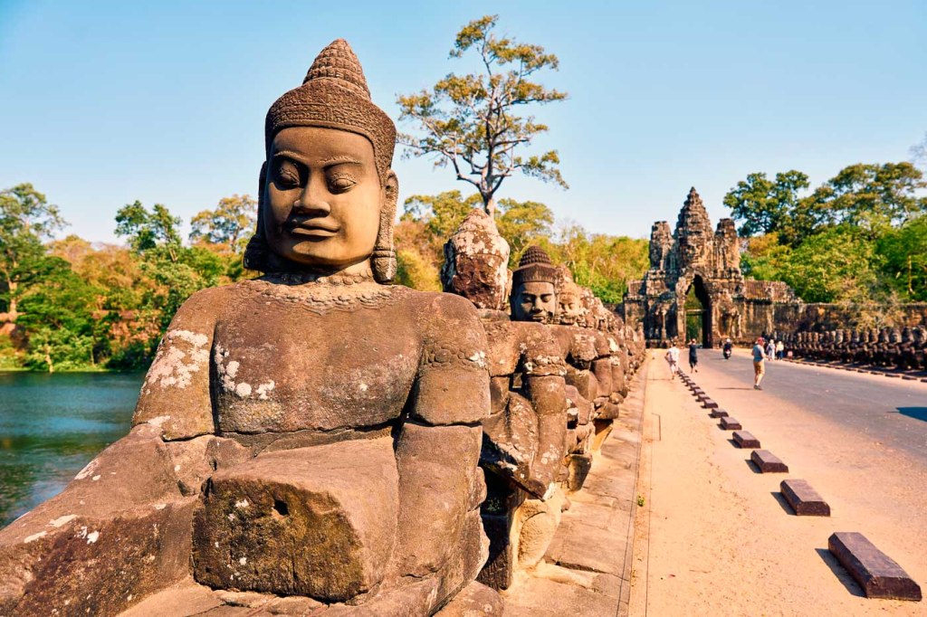 Line of Deva statues along the Angkor Thom South Gate at Siem Reap, Cambodia
